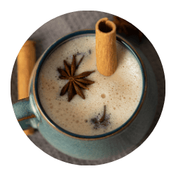 A warm cup of Indian masala chai featuring aromatic spices like cinnamon, star anise, and cardamom, perfect for authentic Indian beverage lovers seeking rich flavors.