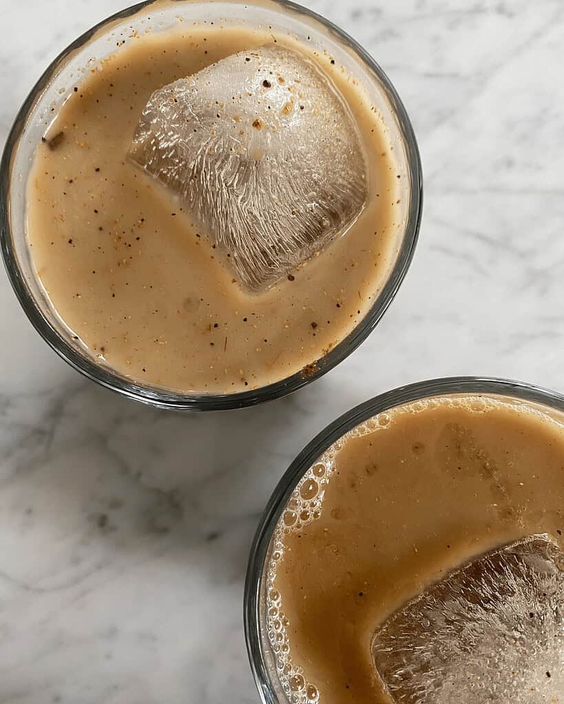 Delicious Indian-style milk tea with ice and spices, served chilled, perfect for refreshment and authentic taste of Indian beverages.