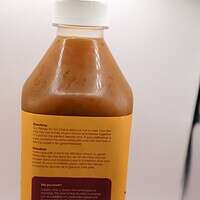 Rich, creamy chai latte beverage in a plastic bottle, perfect for making traditional Indian masala chai or iced chai drinks. Convenient ready-to-go chai with authentic flavor.