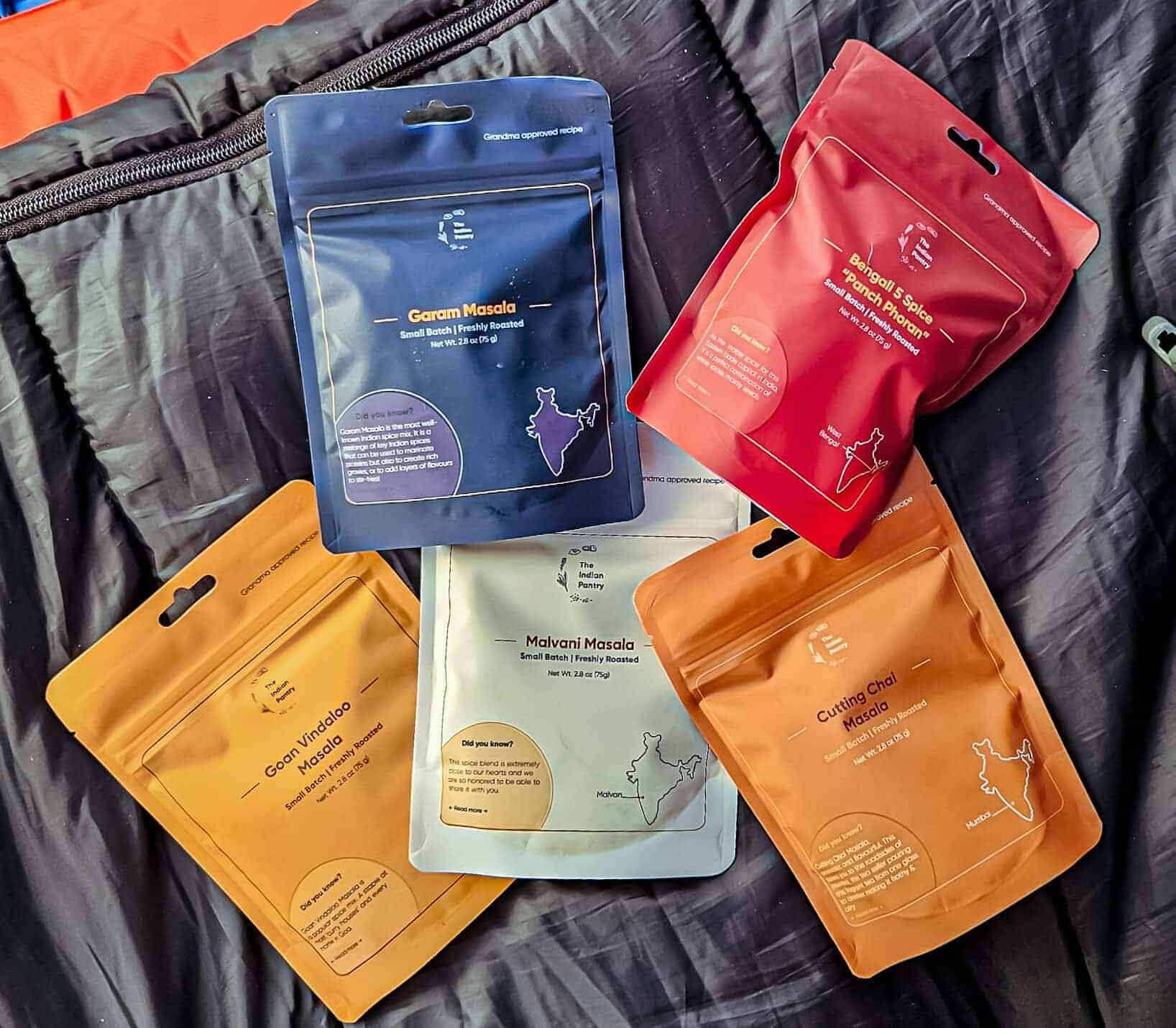 Colorful Indian spice packet collection showcasing traditional masalas from The Indian Pantry for authentic Indian cuisine.